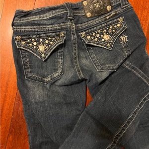 Miss Me jeans, classic fit, fitted through the hip and thigh.